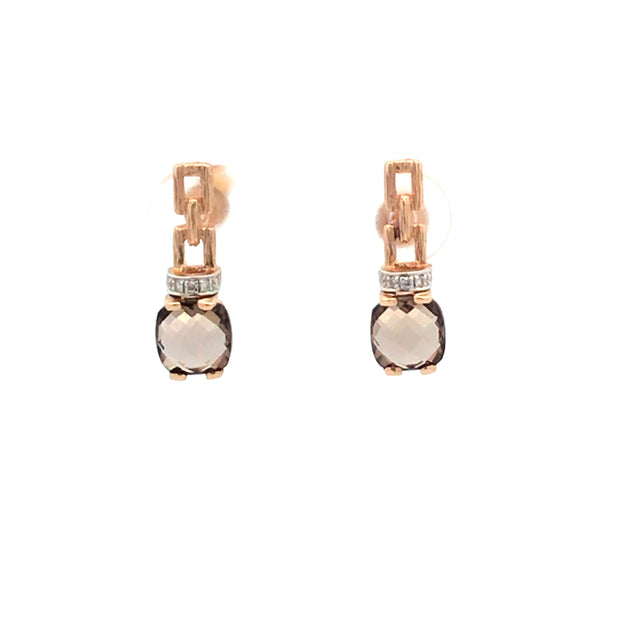 14 karat yellow gold earrings prong set with two 6mm cushion checkerboard cut smoky topaz and prong set with 8 br. @.04ct I1I