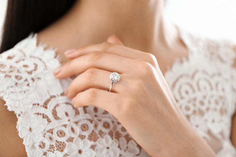 engagement ring and wedding dress
