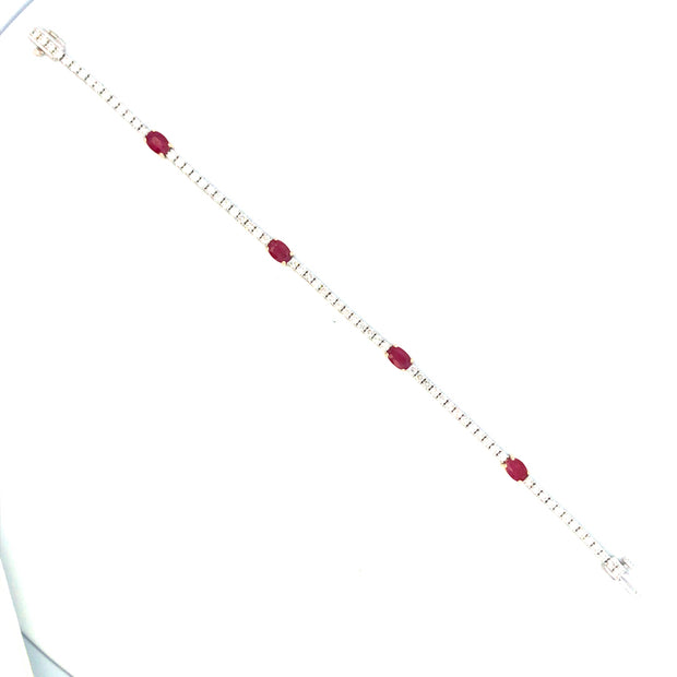 14Kt White Gold 7" Line Bracelet With 4=1.78Tw Oval  Cut Rubies Set In
