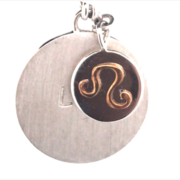 Sterling Silver Round Charm Leo, With A Smaller Charm With 18Kt Yellow Gold Zodiac Emblem