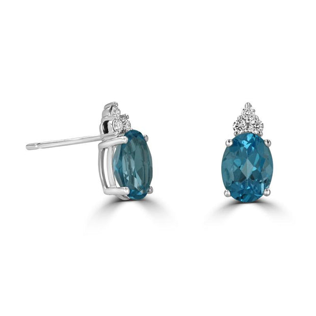 14kt White Gold Earrings With 2.83ct Oval Blue Topaz and 6 Round Diamo
