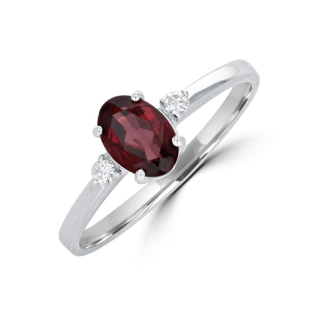 14kt White Gold Ring With Oval Garnet .94ct and 2 Round Diamonds .04td