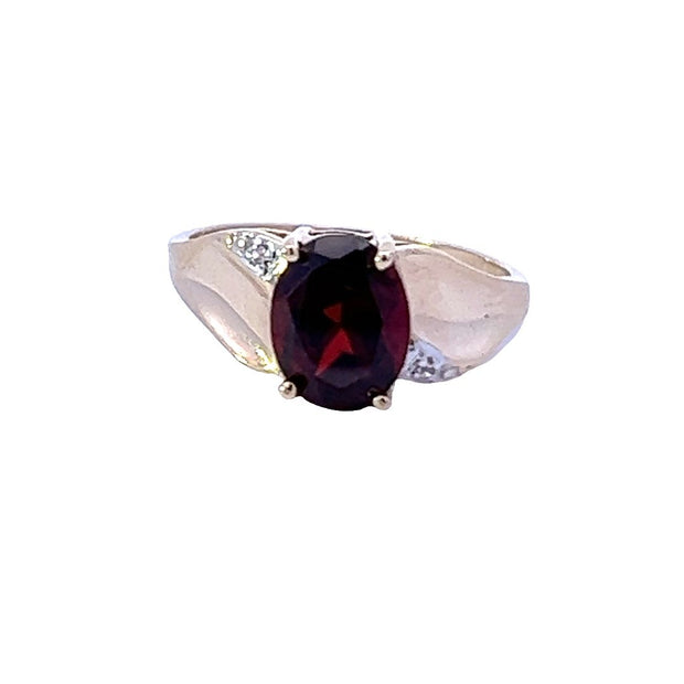 10 Karat Yellow Gold Ring Prong Set With One 9X7mm Oval Garnet And Pro