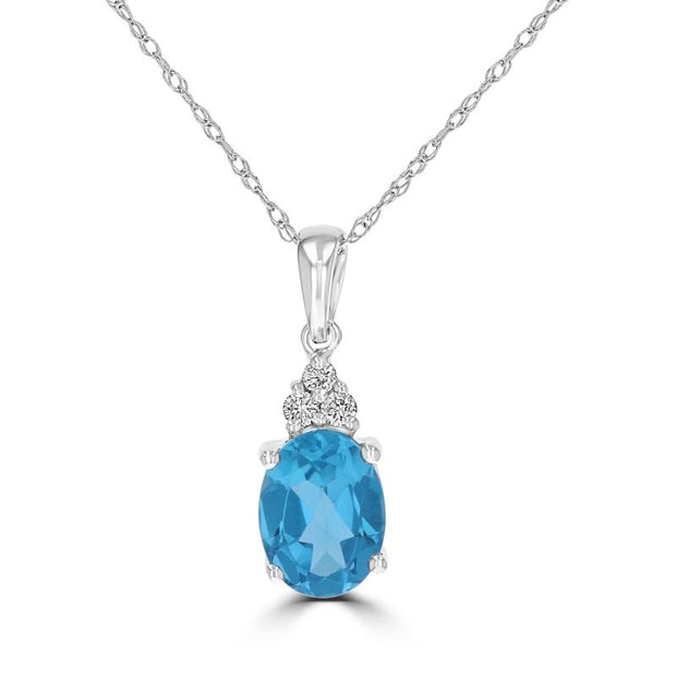 14Kt White Gold Pendant With 1 Oval Blue Topaz 1.51Ct And 3 Diamonds .