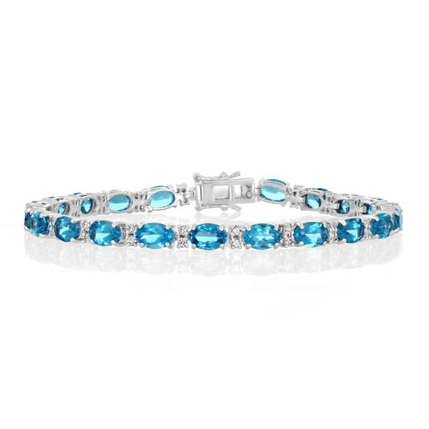 14 Karat White Gold Blue Topaz Bracelet 22-6X4mm Oval And 44 Round Bri